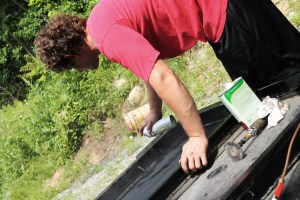 Shawn spraying rust inhibitor.