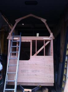 The first rafters for the gambrel roof are up!  Wohoo!